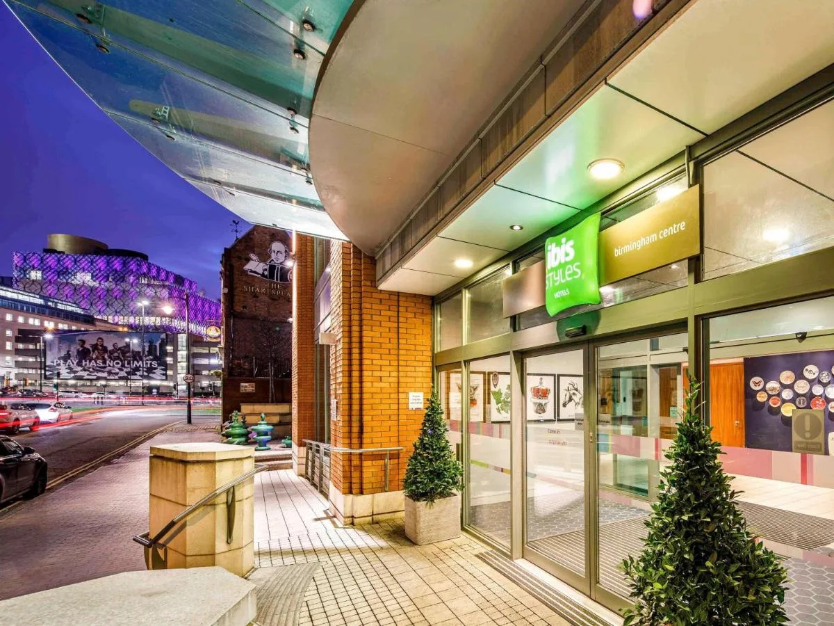 a store front of a building with christmas trees outside at ibis Styles Birmingham Centre in Birmingham